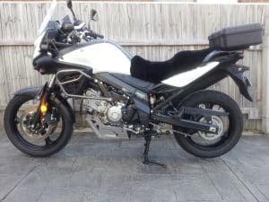 Suzuki DL650 V Strom 2004-2010 Black Sheepskin Motorcycle Seat Cover on White bike