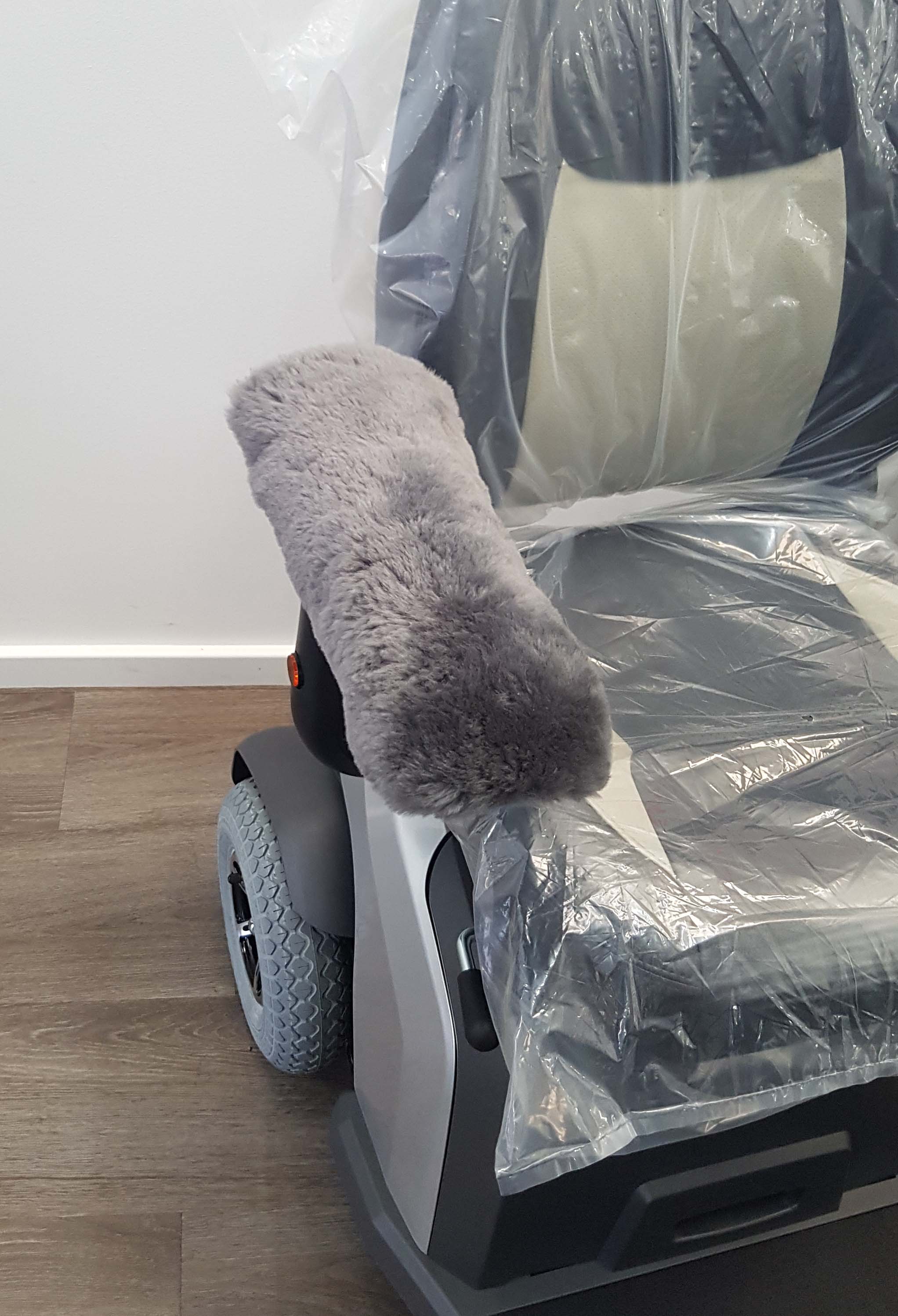 Grey Sheepskin Universal Armrest cover on Mobility Scooter Seat